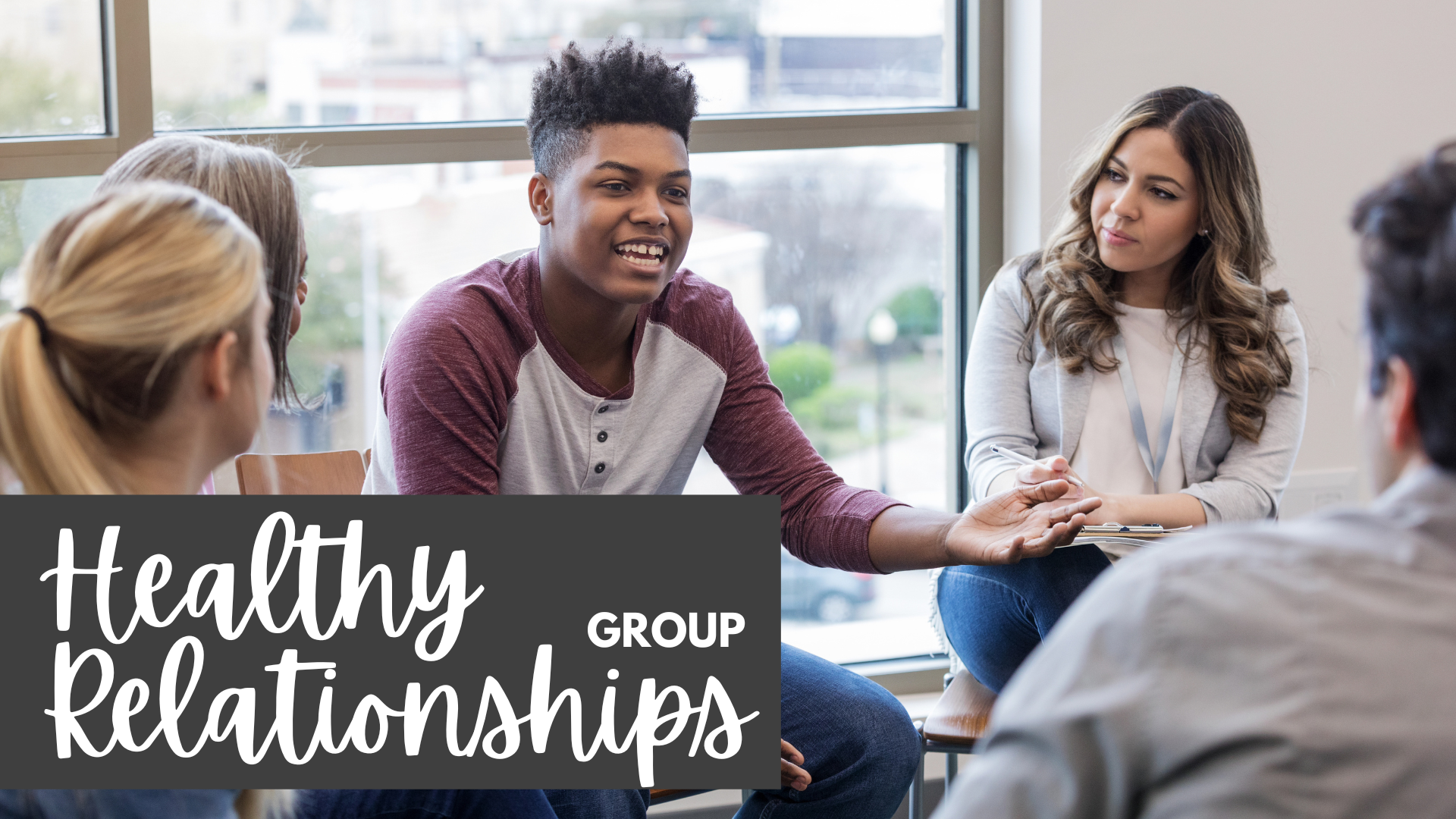 Group of teenagers sitting in a circle discussing various subjects